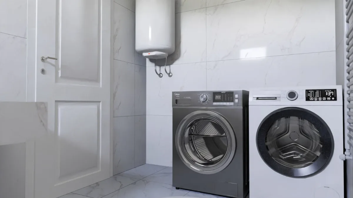 Tank water heater in a laundry room next to a washer and dryer